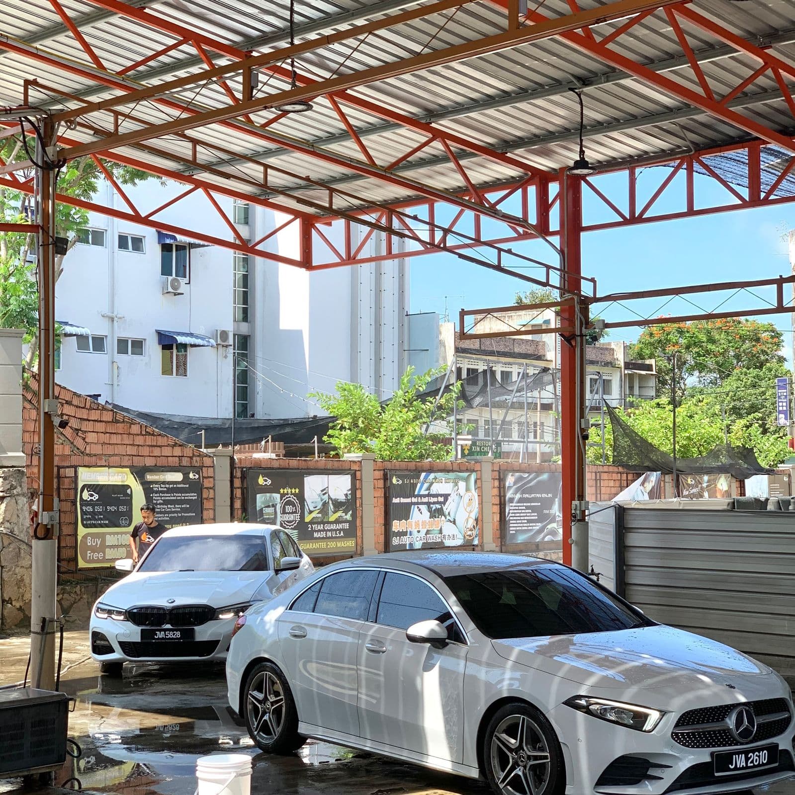 Cars in the wash bays at SJ Auto Car Wash, Kluang