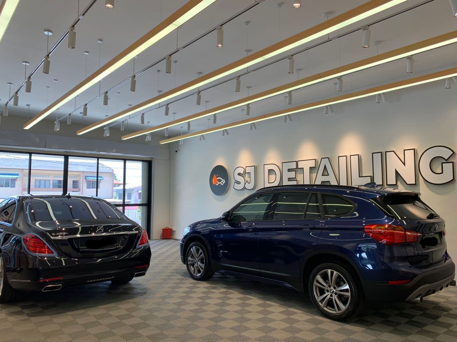 Cars inside the SJ Auto Detailing showroom